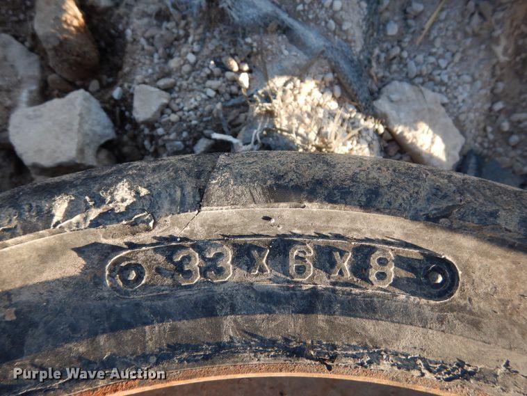 image for item GC9356 (4) 33x6x8 solid tires and wheels