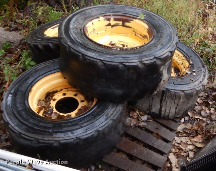 image for item FU9727 (4) 12-16.5 solid tires and wheels