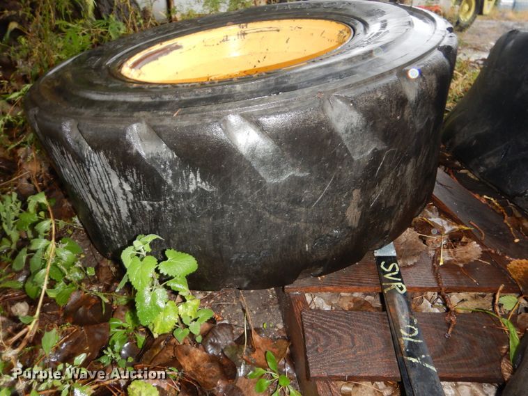 image for item FU9727 (4) 12-16.5 solid tires and wheels