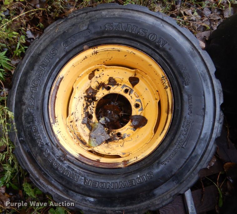 image for item FU9727 (4) 12-16.5 solid tires and wheels