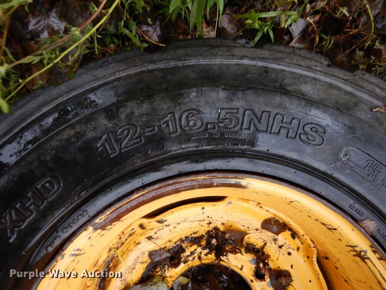 image for item FU9727 (4) 12-16.5 solid tires and wheels