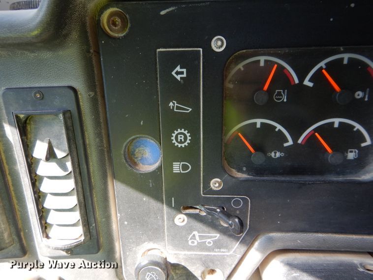 image for item DG7033 1999 Caterpillar 775D haul truck