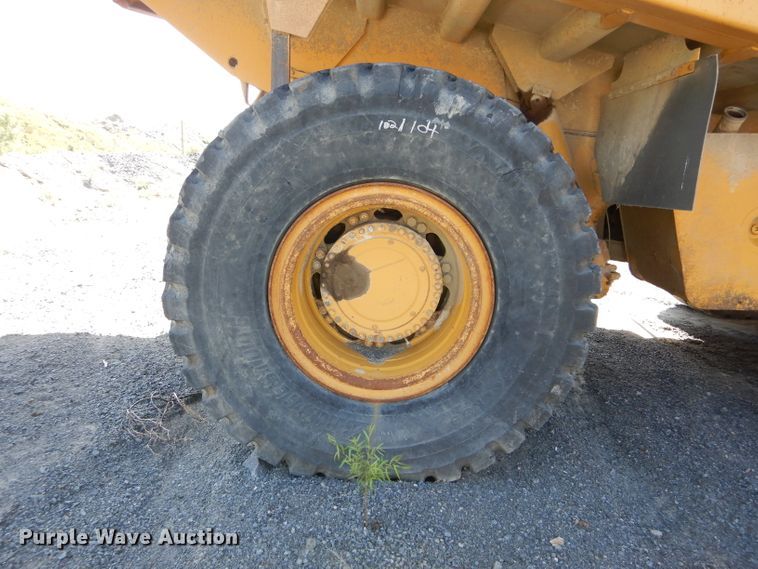 image for item DG7033 1999 Caterpillar 775D haul truck