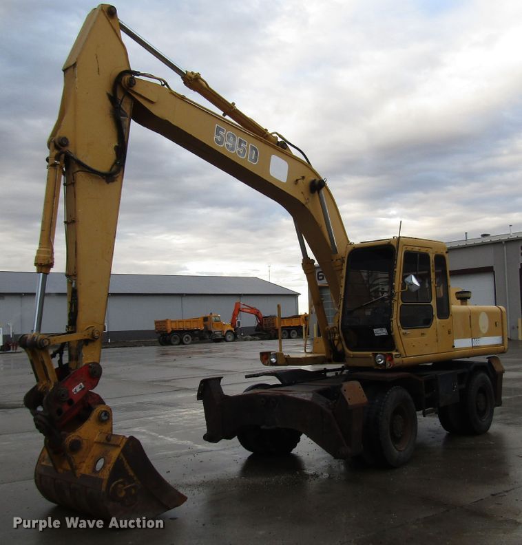 image for item DG6641 1994 John Deere 595D rubber tire excavator