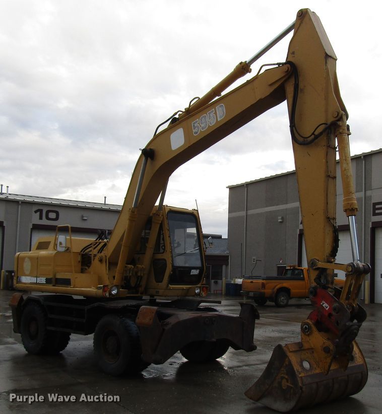 image for item DG6641 1994 John Deere 595D rubber tire excavator