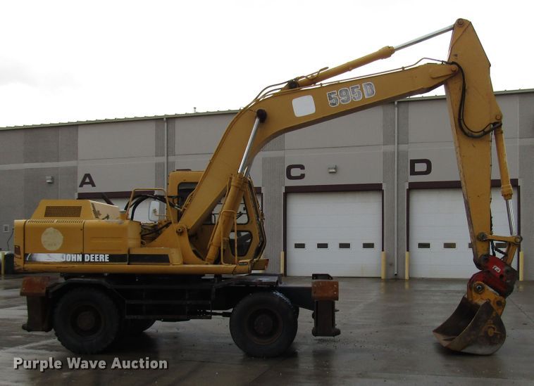 image for item DG6641 1994 John Deere 595D rubber tire excavator