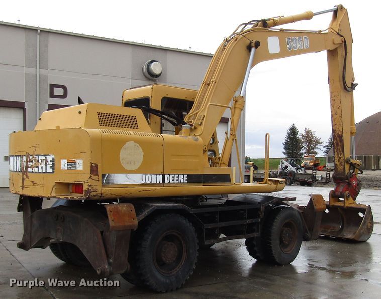 image for item DG6641 1994 John Deere 595D rubber tire excavator