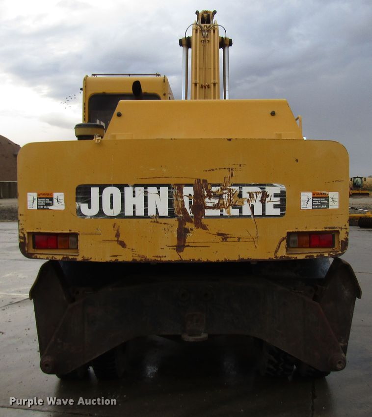 image for item DG6641 1994 John Deere 595D rubber tire excavator