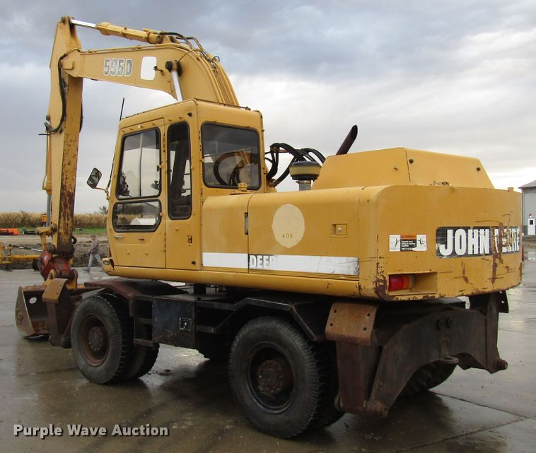 image for item DG6641 1994 John Deere 595D rubber tire excavator
