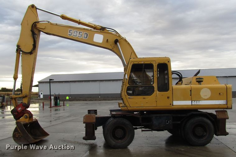 image for item DG6641 1994 John Deere 595D rubber tire excavator