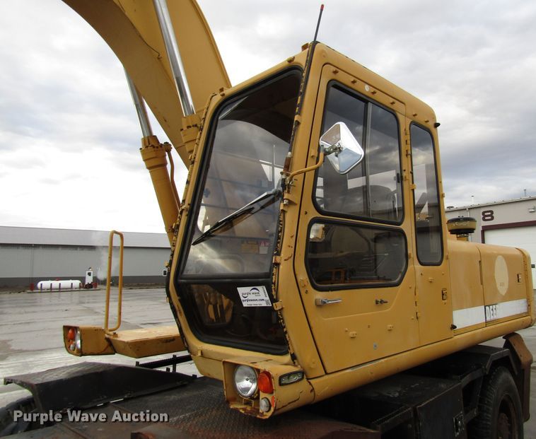 image for item DG6641 1994 John Deere 595D rubber tire excavator