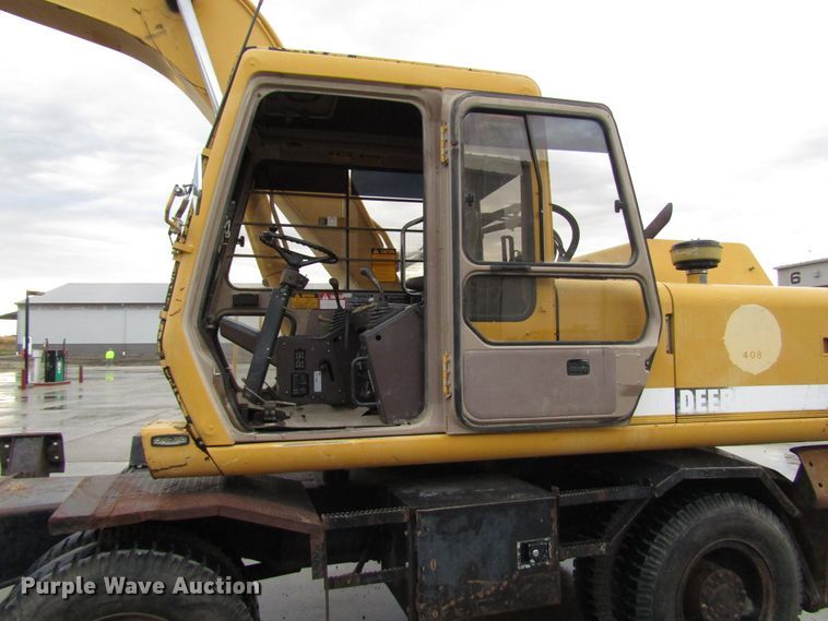 image for item DG6641 1994 John Deere 595D rubber tire excavator