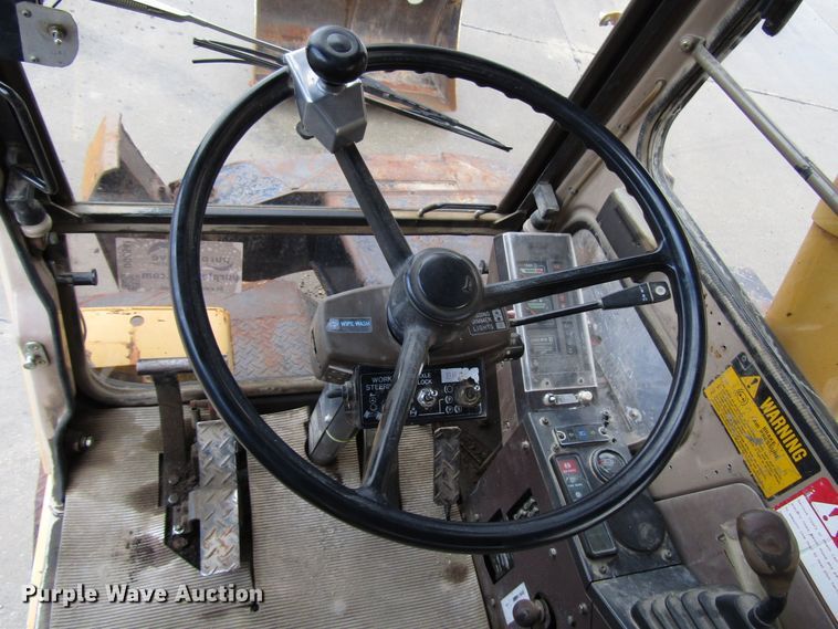 image for item DG6641 1994 John Deere 595D rubber tire excavator