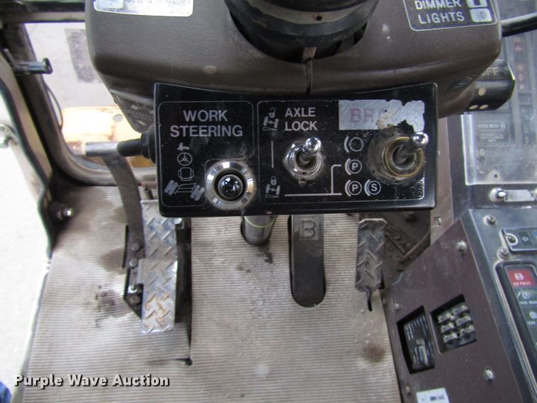 image for item DG6641 1994 John Deere 595D rubber tire excavator