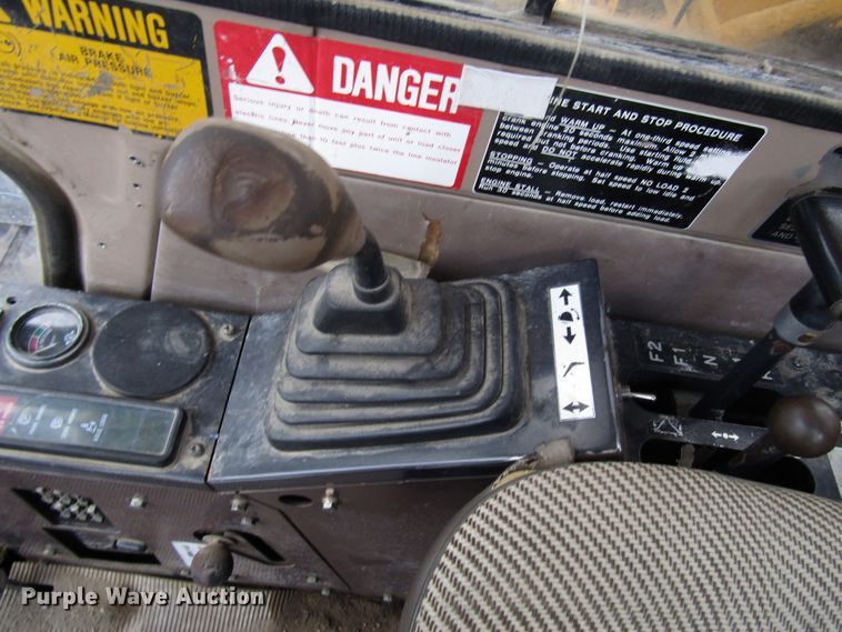 image for item DG6641 1994 John Deere 595D rubber tire excavator