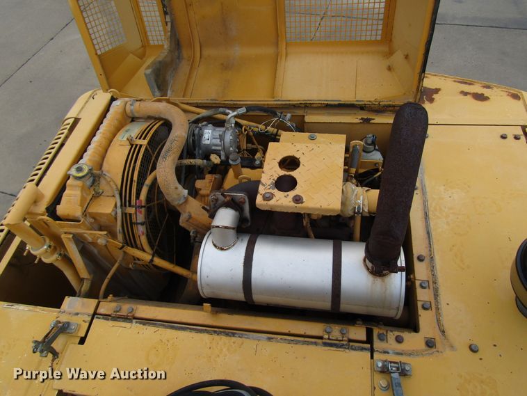 image for item DG6641 1994 John Deere 595D rubber tire excavator