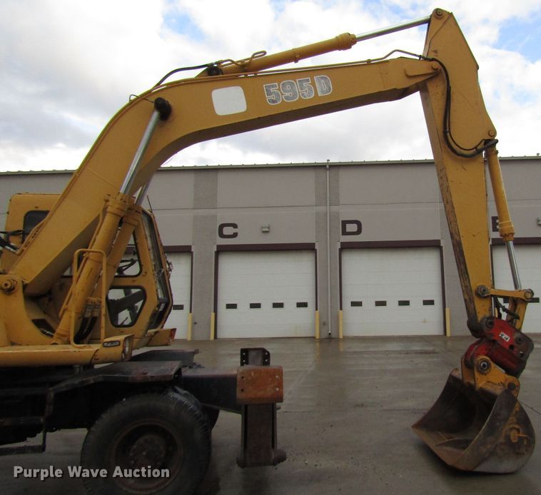 image for item DG6641 1994 John Deere 595D rubber tire excavator