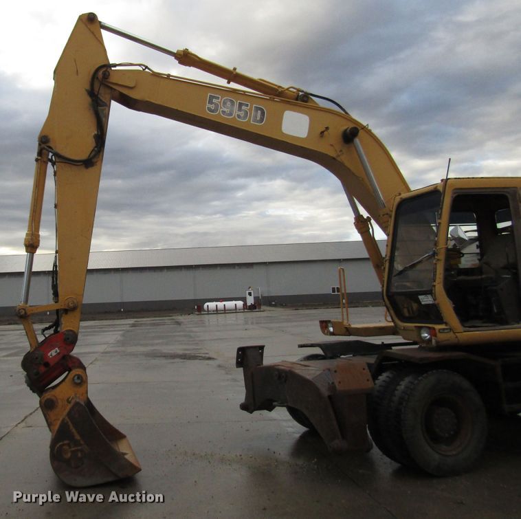 image for item DG6641 1994 John Deere 595D rubber tire excavator