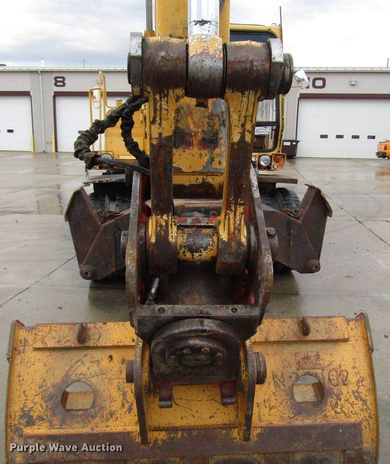 image for item DG6641 1994 John Deere 595D rubber tire excavator