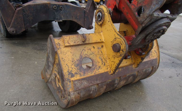 image for item DG6641 1994 John Deere 595D rubber tire excavator