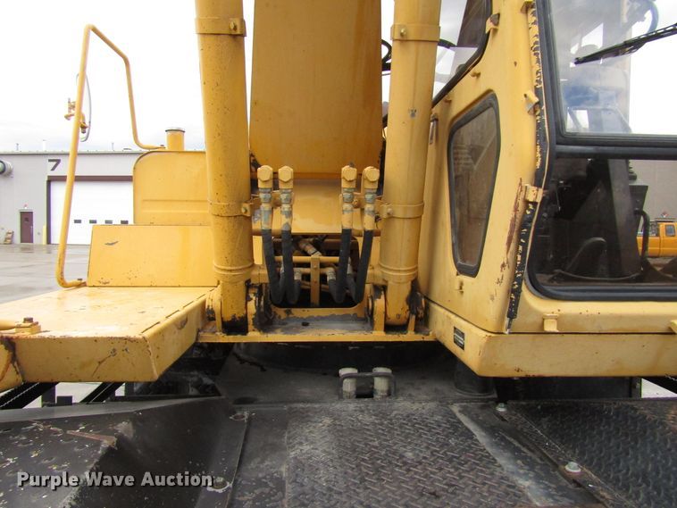 image for item DG6641 1994 John Deere 595D rubber tire excavator