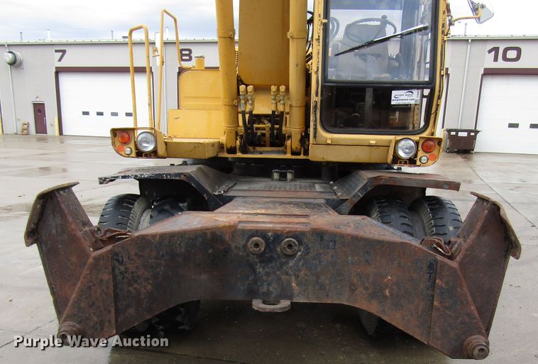 image for item DG6641 1994 John Deere 595D rubber tire excavator