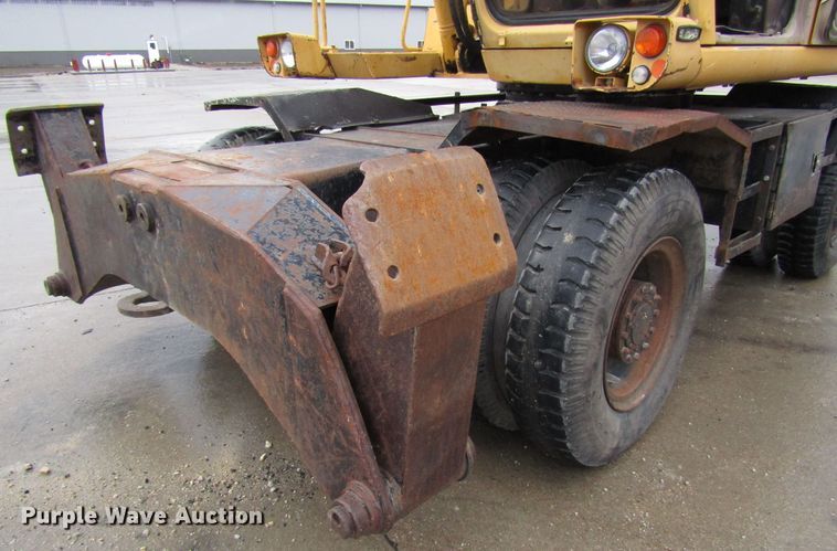 image for item DG6641 1994 John Deere 595D rubber tire excavator