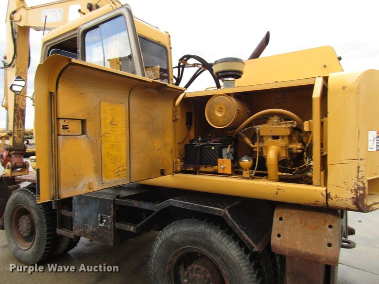 image for item DG6641 1994 John Deere 595D rubber tire excavator