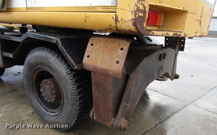 image for item DG6641 1994 John Deere 595D rubber tire excavator