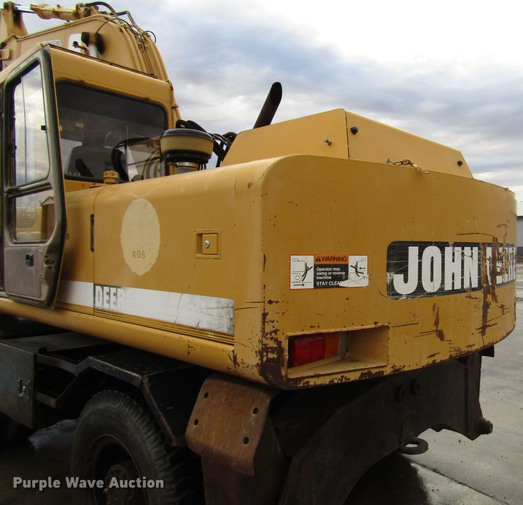 image for item DG6641 1994 John Deere 595D rubber tire excavator