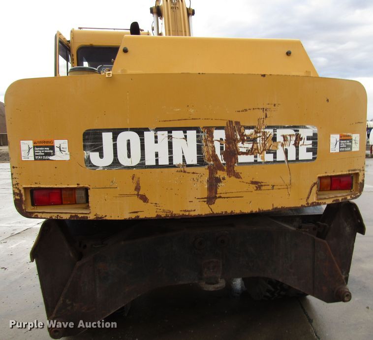 image for item DG6641 1994 John Deere 595D rubber tire excavator