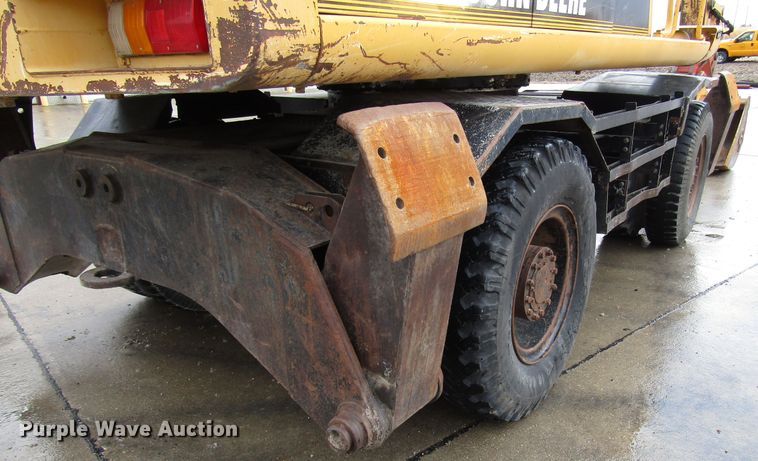 image for item DG6641 1994 John Deere 595D rubber tire excavator