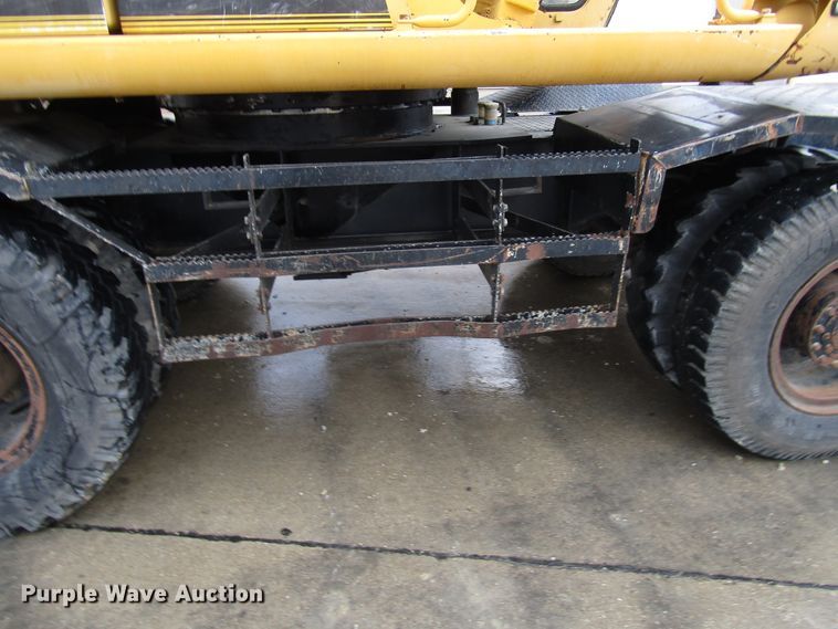 image for item DG6641 1994 John Deere 595D rubber tire excavator