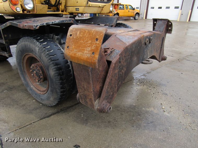 image for item DG6641 1994 John Deere 595D rubber tire excavator