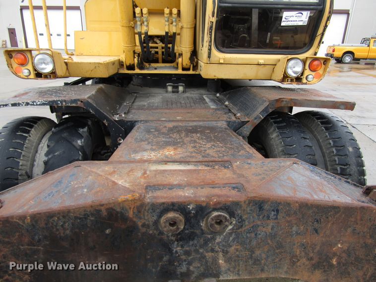 image for item DG6641 1994 John Deere 595D rubber tire excavator