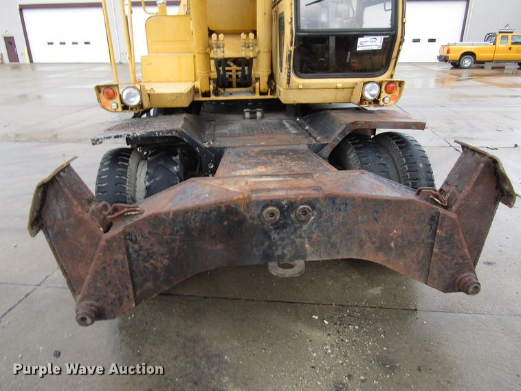 image for item DG6641 1994 John Deere 595D rubber tire excavator