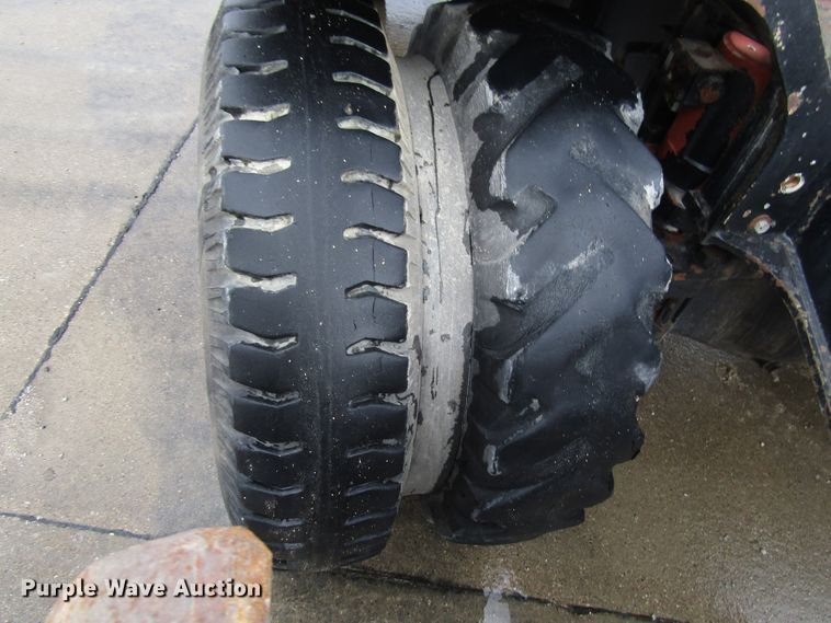 image for item DG6641 1994 John Deere 595D rubber tire excavator