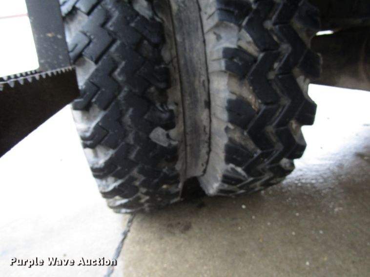 image for item DG6641 1994 John Deere 595D rubber tire excavator