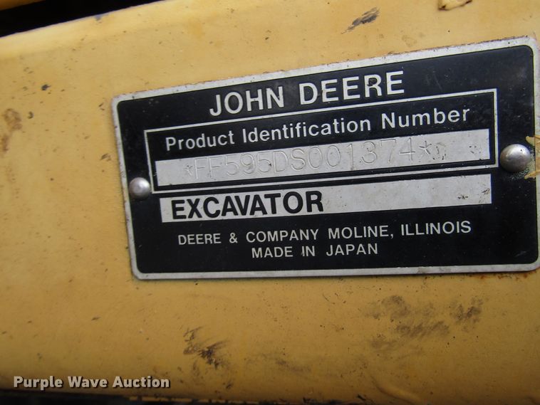 image for item DG6641 1994 John Deere 595D rubber tire excavator