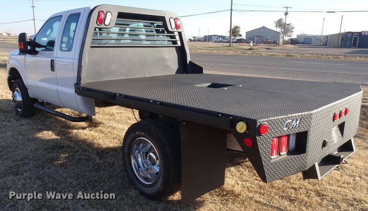 image for item GC9080 2015 Ford F350 Super Duty SuperCab flatbed pickup truck