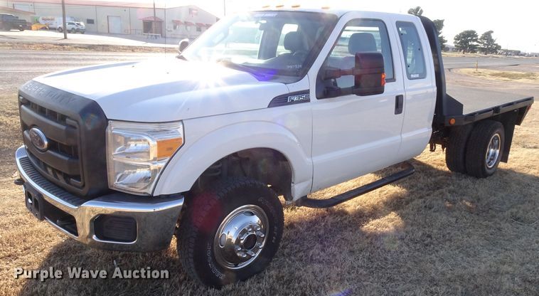 image for item GC9080 2015 Ford F350 Super Duty SuperCab flatbed pickup truck