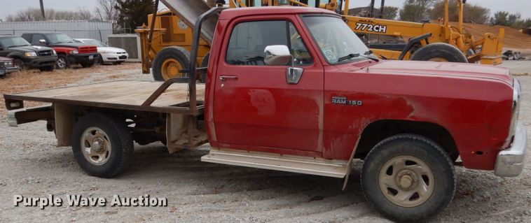 image for item EC9124 1991 Dodge Ram 150 flatbed pickup truck
