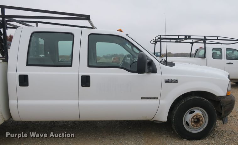 image for item DB10127 2002 Ford F350 Super Duty Crew Cab utility bed pickup truck