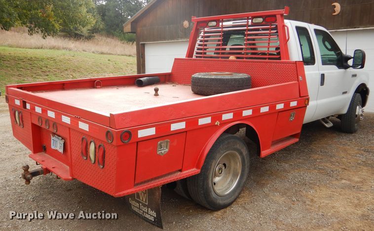 image for item DD4553 2005 Ford F350 Super Duty XLT SuperCab flatbed pickup truck
