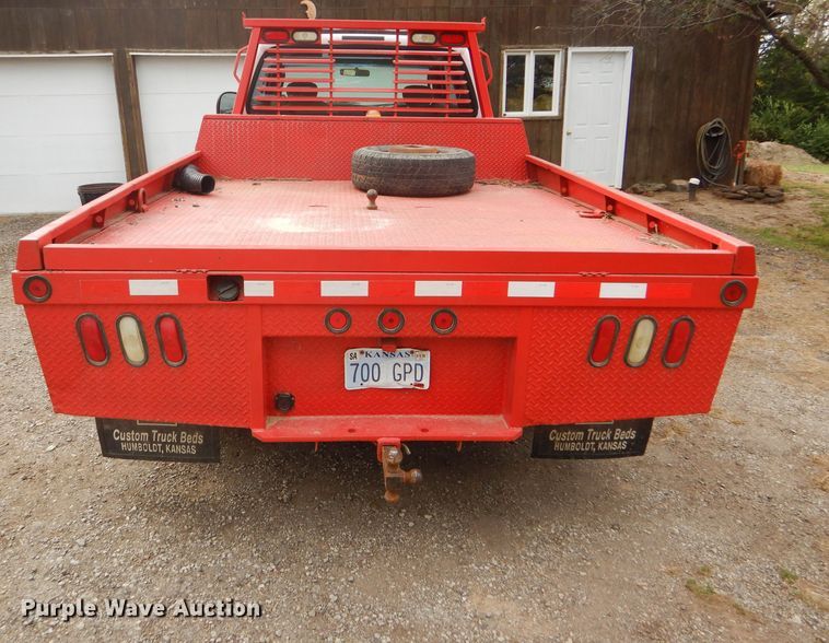 image for item DD4553 2005 Ford F350 Super Duty XLT SuperCab flatbed pickup truck