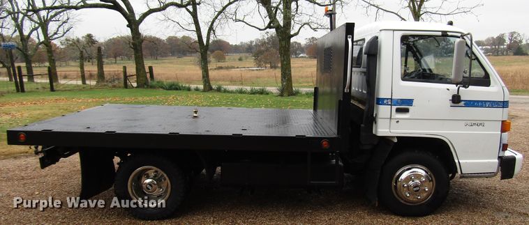 image for item DG6663 1994 Isuzu NPR flatbed truck
