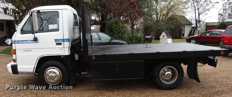 image for item DG6663 1994 Isuzu NPR flatbed truck