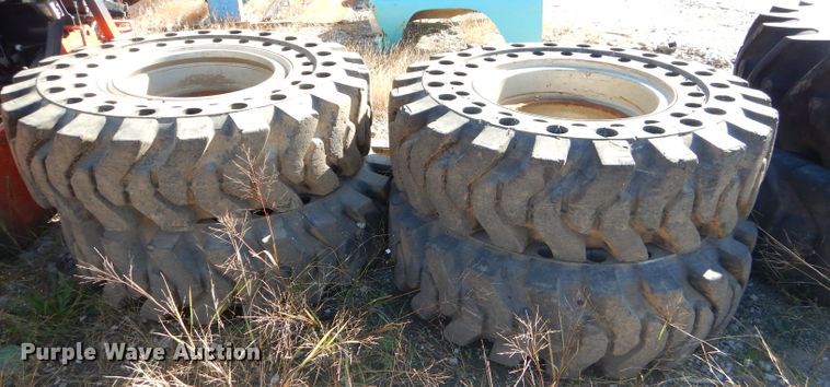 image for item EY9498 (4) 14.00-24 solid tires and wheels