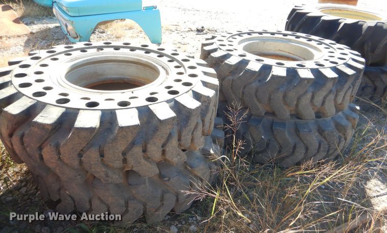 image for item EY9498 (4) 14.00-24 solid tires and wheels