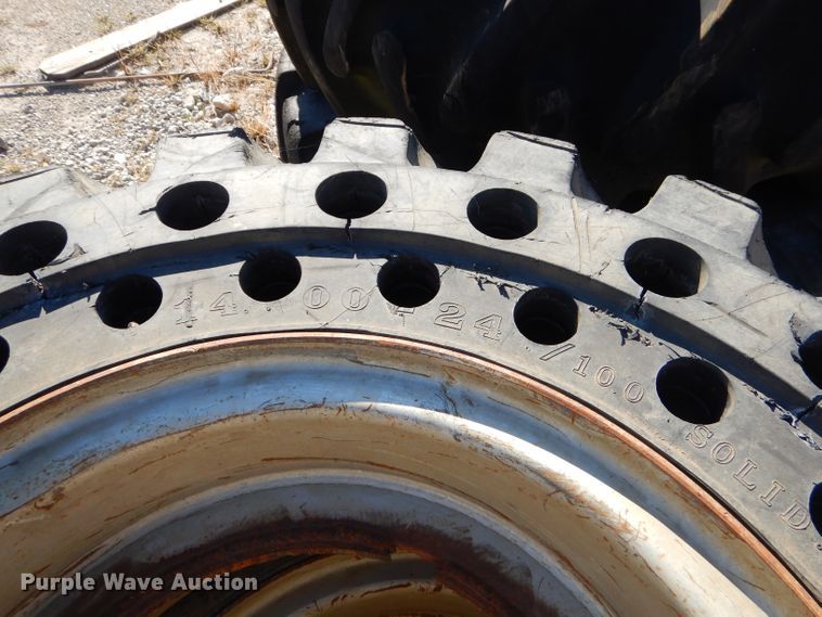 image for item EY9498 (4) 14.00-24 solid tires and wheels